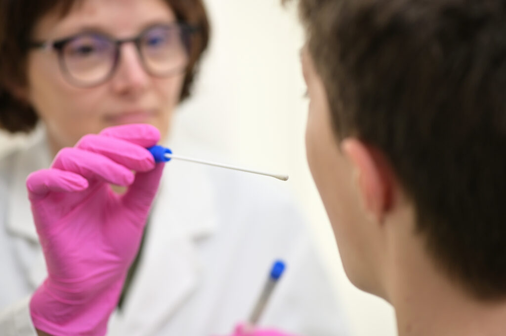 Doctor Collecting with a nasopharyngeal nose and throat swab